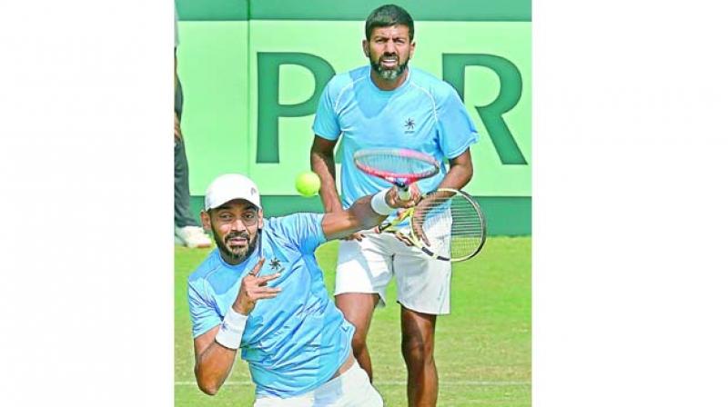 Divij Sharan and Rohan Bopanna in action against Italys Matteo Berrettini and Simone Bolelli on Saturday. (Photo:PTI)