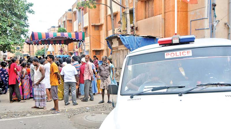 An anxious crowd gathers near the scene of action in Kannagi Nagar, on Sunday. (Photo: DC)