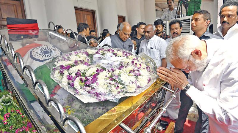 Prime Minister Narendra Modi pays his last respects to DMK chief M Karunanidhi at Rajaji Hall, in Chennai on Wednesday. (Photo: DC)