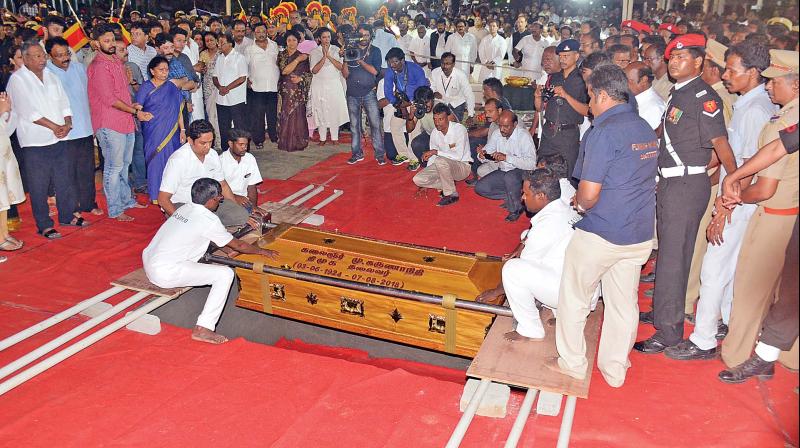 The coffin containing the mortal remains of DMK  president M. Karunanidhis being lowered on Marina, on Wednesday. (Photo: DC)