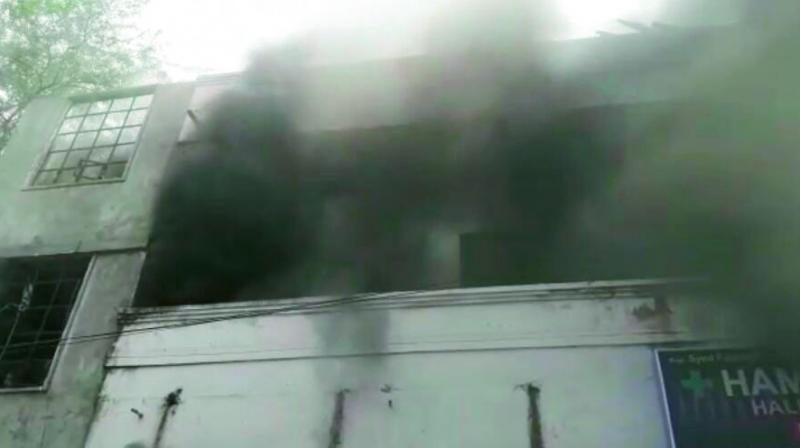 A view of the fire at a furniture godown in Tappachabutra in the city. (Photo:DC)