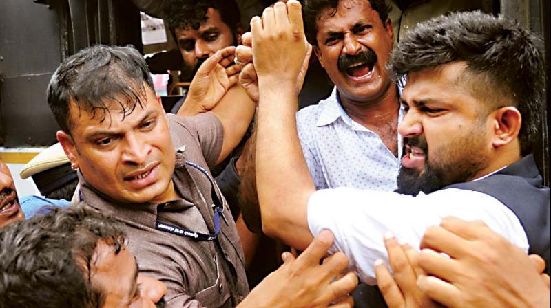 Mysuru BJP MP Pratap Simha being arrested during the Mangaluru Chalo rally organised by the BJP in the city on Tuesday. (below) Former Deputy CM R. Ashok was also arrested during the protest against the ban on the bike rally