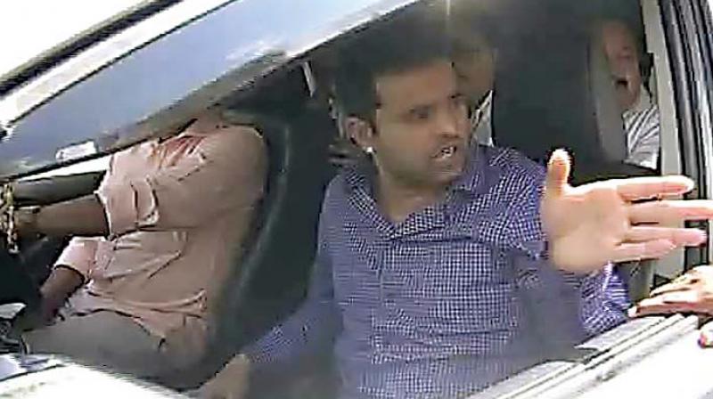 Minister H.D. Revannas son Prajwal travelling in his fathers official car in Hassan on Tuesday 	 DC