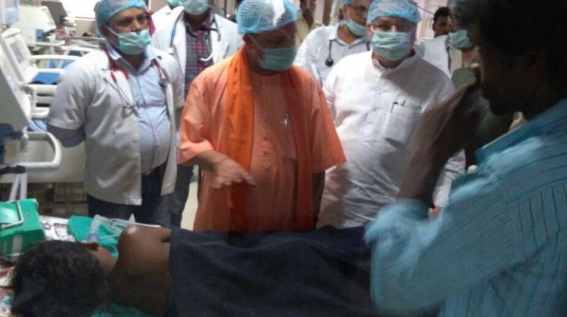 Children admitted in a ward in the state-run Baba Raghav Das Medical College in Gorakhpur, on Saturday. (Photo: PTI)