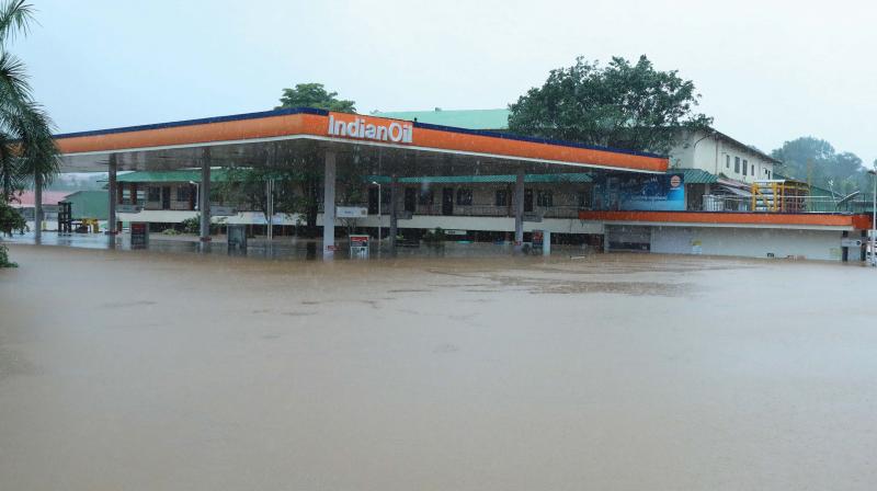 A retail petrol and diesel bunk of the Indian Oil Corporation Ltd at Kalamassery is seen fully submerged in water.   (Image: ARUN CHANDRABOSE)
