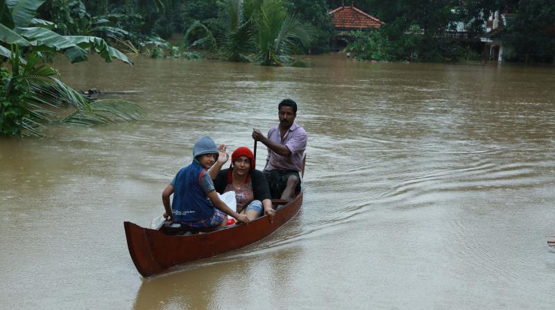 A family  affected by the floods being rescued at Muvattupuzha in Ernakulam district on Thursday                ( Image: ARUN CHANDRABOSE)
