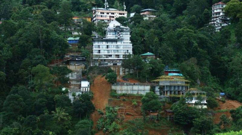 Munnar town was isolated following the rising water level in the town and landslips blocking vehicular traffic.