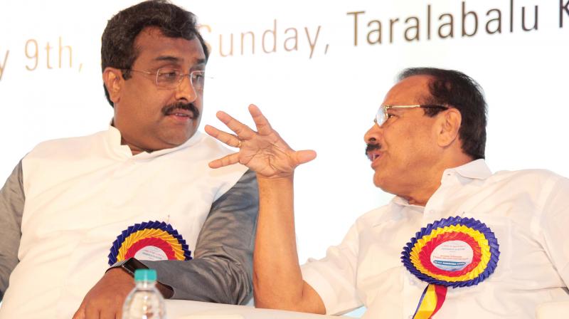 BJP general secretary V. Ram Madhav and Union Minister D.V. Sadananda Gowda  at a seminar in Bengaluru on Sunday  (Photo:DC)