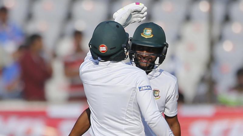 Bangladeshs captain Mushfiqur Rahim, left, hugs teammate Mehedi Hasan to congratulate him on scoring fifty runs during the third day of the cricket test match against India in Hyderabad, India, Saturday, Feb. 11, 2017. (Photo: AP)