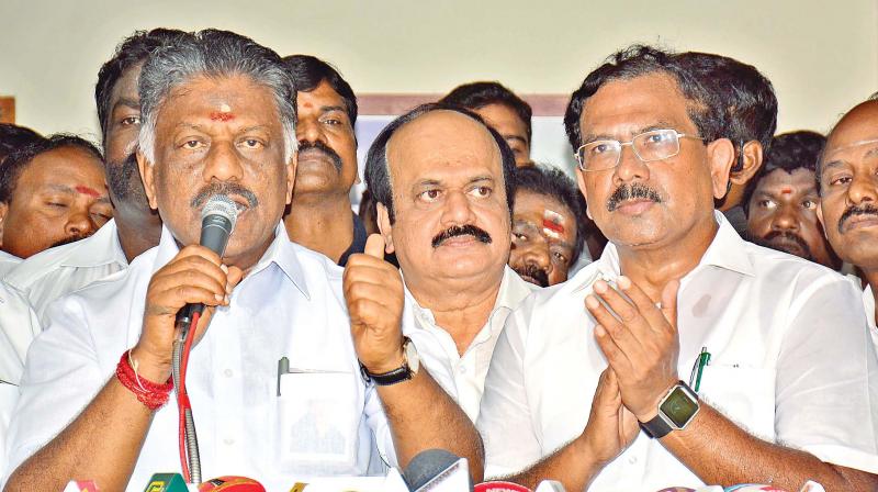 School education minister K. Pandiarajan applauding Chief Minister O. Panneeselvams speech at his residence in the city on Saturday (Photo: DC)