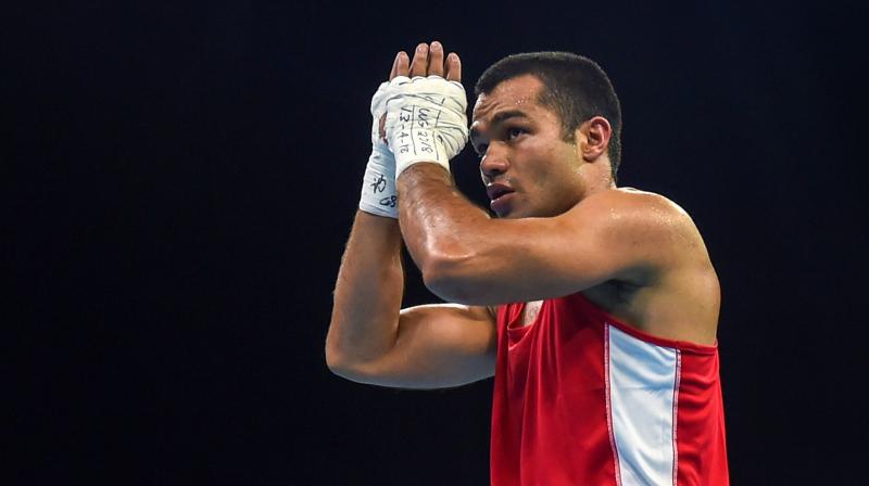 Vikas went on to win a split decision after being forced to box at distance to protect the wound but his withdrawal means he will have to settle for a bronze medal. (Photo: PTI)