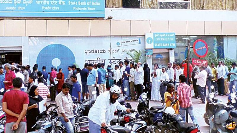 With a small stock of smaller notes available and new bills of 500 and 2,000 rupee in short supply, Indians had to stand in snaking queues outside banks and cash machines to change their old notes.