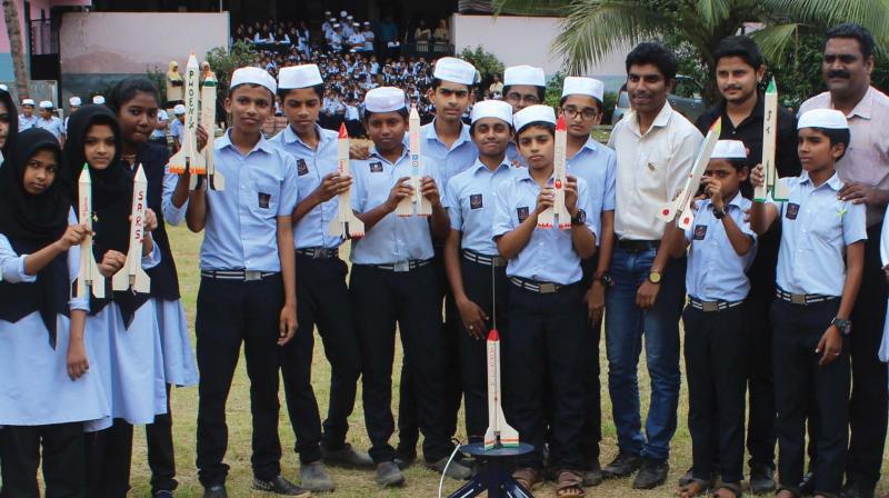 Students of Madaru Dawathul Islamiya public school in Karulai near Nilambur with rockets they made.