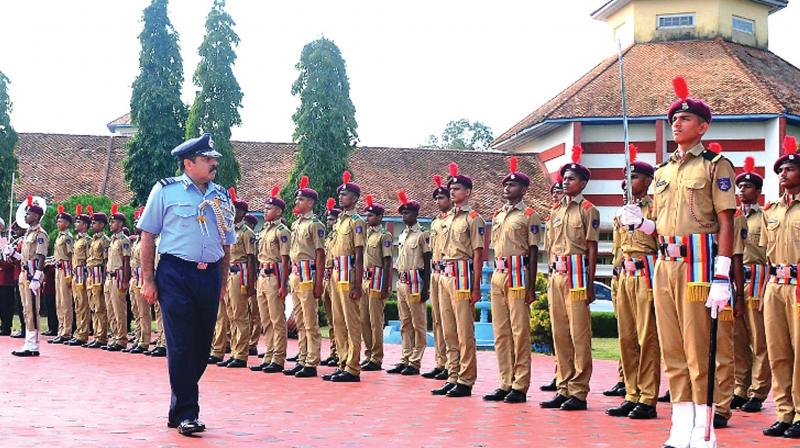 Air Marshal Rakesh Kumar Singh Bhadauria reviews the Guard of Honour during his maiden visit to Sainik School, Kazhakootam.