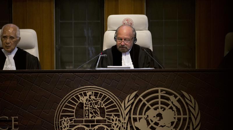 Presiding judge Ronny Abraham of France, center, reads the World Courts verdict in the case brought by India against Pakistan in The Hague. (Photo: AP)