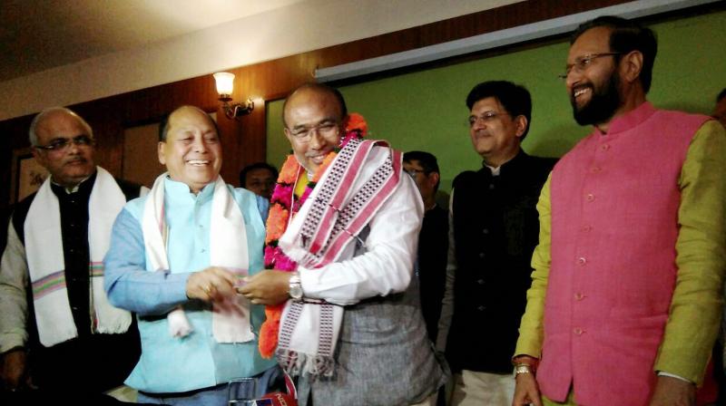 Nongthombam Biren Singh is greeted after he was elected at BJP legislature party leader in Imphal on Monday. Union Power Minister and BJP observer Piyush Goyal and HRD Minister Prakash Javadekar are also seen. (Photo)