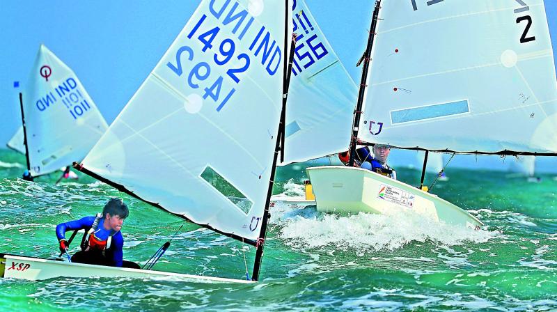 Leading the fleet goes past the Seychelles sailor at the leeward mark at the India International in Chennai.