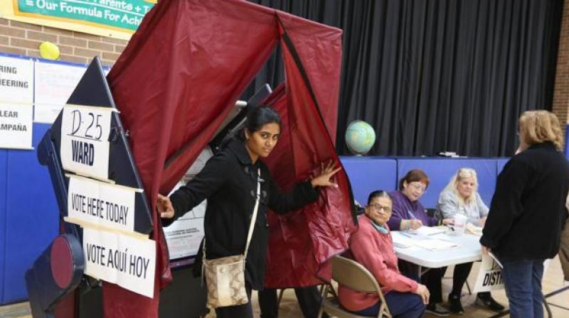 Indian American voters casting their votes in Jersey city, New Jersey on Tuesday. (Photo: PTI)
