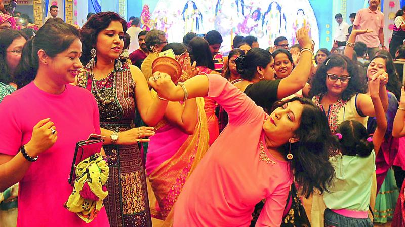 Women participate in the celebrations of the 76-year-old Bengali Samiti Navratri festival at Lower Tank Bund on Friday.   (Photo: Deepak Deshpande)