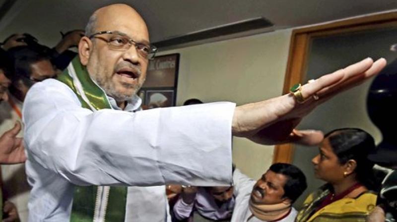 BJP President Amit Shah interacts with the party workers and their families who have been affected by the alleged political violence in the State, during a meeting in Kolkata on Tuesday. (Photo: PTI)