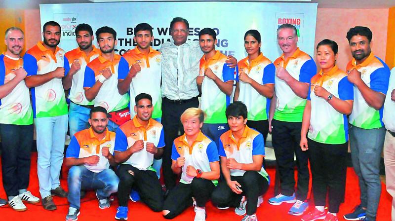 The Indian boxing contingent pose along with Boxing Federation of India president Ajay Singh during the send off ceremony in New Delhi on Tuesday for the Asian Games. Also seen in the picture is Mohammad Hussamuddin of Telangana who is squatting second from left.