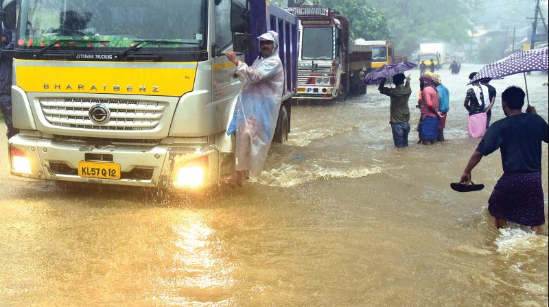 Kozhikode-Bangalore National Highway 766 was flooded at Eengappuzha, Thamarassery, on Tuesday.