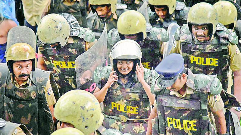 Journalist Kavitha Jakkal being escorted by the police to Sabarimala Temple on Friday.