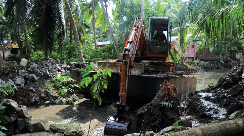 File picture of a pond dune cleaning Kariyil Thodu. The work was later excluded from operation Anantha.