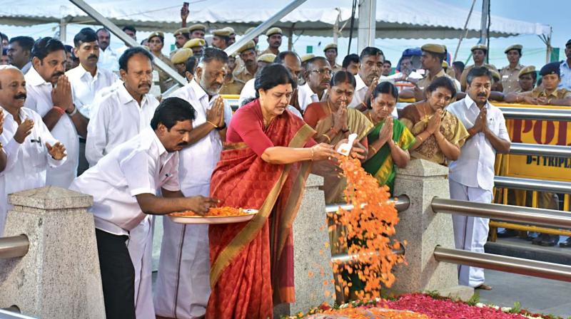 V.K. Sasikala, the new general secretary of AIADMK, offers floral tribute to late Chief Minister J. Jayalalithaa at her memorial on the Marina on Friday. (Photo: DC)