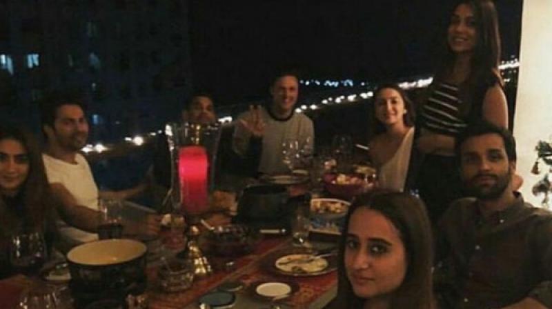 Varun and his friends (including Natasha) at his new home.