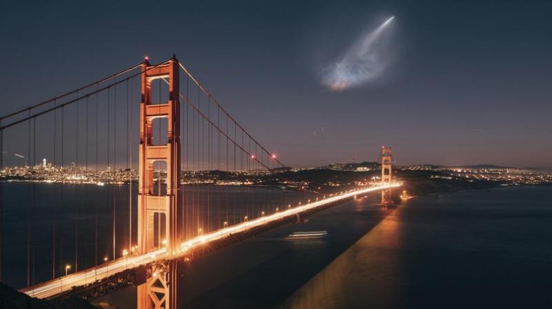 A SpaceX Falcon 9 rocket launch is seen in the distance over the Golden Gate Bridge near Sausalito, Calif. When SpaceX launched a rocket carrying an Argentine Earth-observation satellite from California, both the night sky and social media lit up. People as far away as Phoenix and Sacramento posted photos of the rocket returning to its launch site on Sunday night in what was the first time SpaceX landed a first-stage booster back at its launch site at Vandenberg Air Force Base. (Justin Borja via AP)