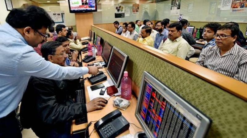 Brokers tracking the stock market as Sensex soared over 400 points to regain 28,000 mark following the tabling of Union Budget 2017-18. (Photo: AP)