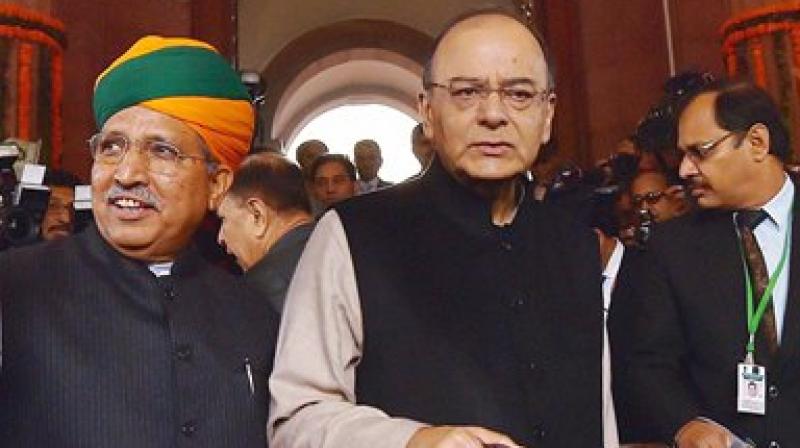 Finance Minister Arun Jaitley with MoS Arjun Ram Meghwal arrives at Parliament to present the Union Budget 2017-18 in the Lok Sabha, in New Delhi. (Photo: AP)