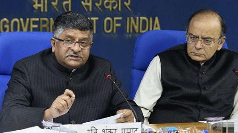 Minister for Electronics & Information Technology, Ravi Shankar Prasad and Finance Minister Arun Jaitley addresses a press conference after cabinet meeting in New Delhi. (Photo: AP)