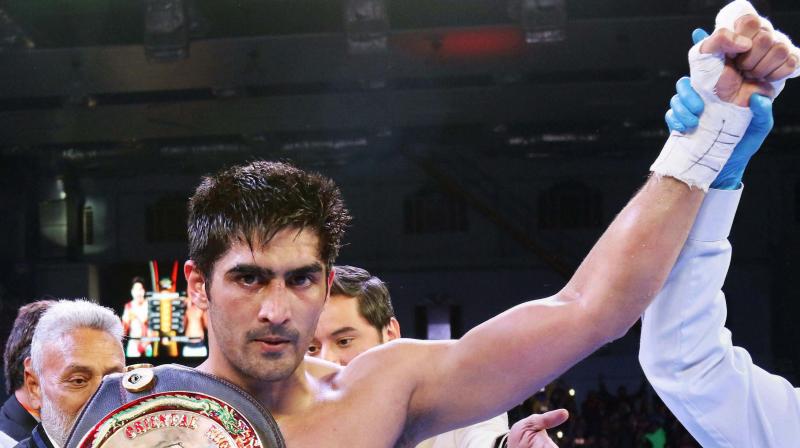 Beijing Olympics bronze medalist and current unbeaten super middleweight contender Vijender Singh is all set for making a debut in the United States boxing as he signed a multi-year agreement with Top Rank, Hall of Fame promoter Bob Arum. (Photo: PTI)