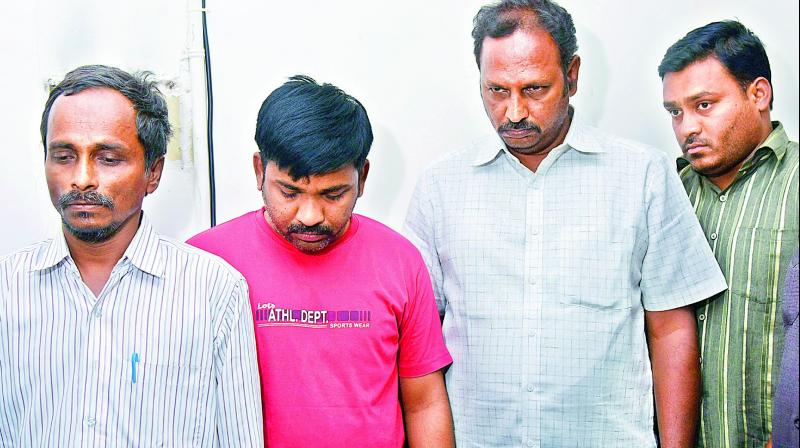 The four people who were arrested on Saturday with old currency worth Rs 42,70,000. (Photo: DC)