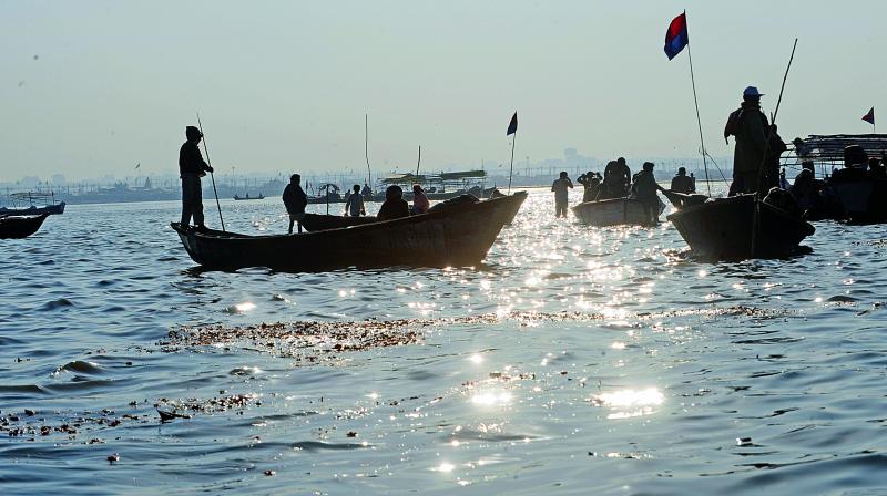 Pilgrims take an early morning boat ride at the Sangam in Allahabad