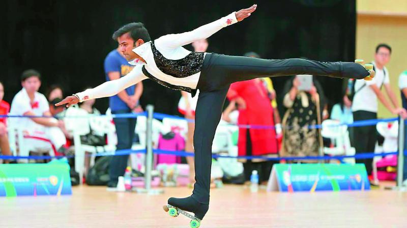 Anup Yama performs a routine during the artistic figure skating discipline at the Asian Skating Championship held in Lishui, China.