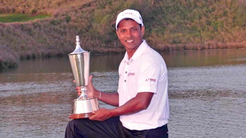S.S.P. Chawrasia poses with the winners trophy. (Photo: DC)