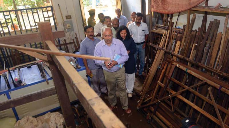 Officials of World Bank and Asian Development Bank at the sales depot of Chendamangalam Handloom society which was completely devastated in the flood.