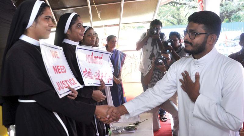 A catholic priest greets the nuns at the protest venue in Kochi on Saturday. (Photo: SUNOJ NINAN MATHEW)