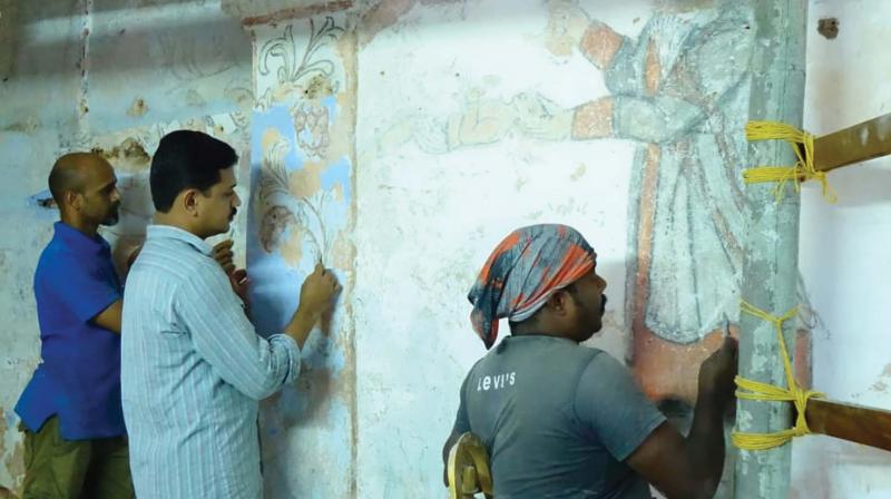 Artistes engaged in conservation of the mural paintings found on the wall of St. Marys Orthodox Cathedral in Pazhanji.