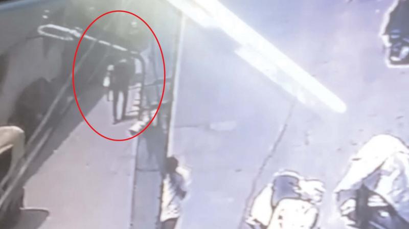 The CCTV footage, which shows the boy carrying the baby
