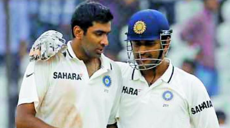 A file picture of R. Ashwin and M.S. Dhoni.