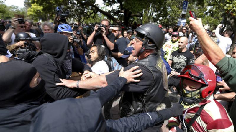 Anti and pro-Donald Trump supporters clash during competing demonstrations at Martin Luther King Jr. Civic Center Park in Berkeley, Calif.(Photo:AP)
