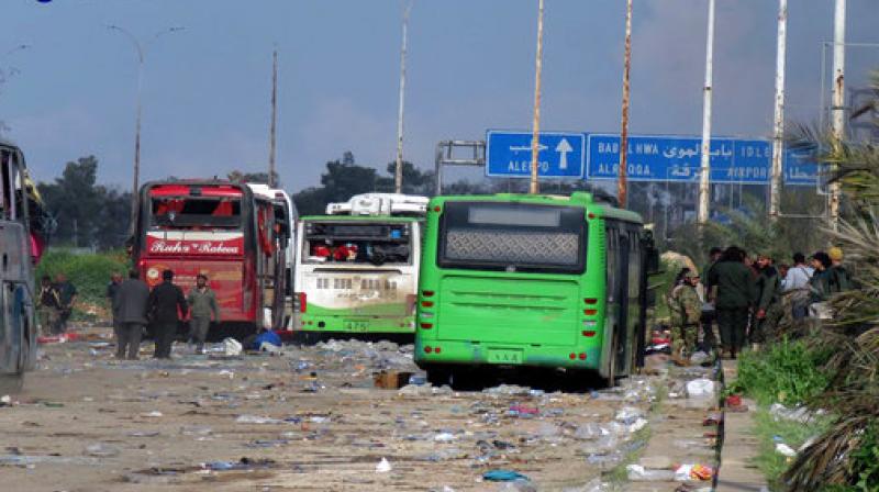 This image released by the Thiqa News Agency, shows buses at the evacuation point where an explosion hit at the Rashideen area, a rebel-controlled district outside Aleppo city, Syria.(Photo:AP)