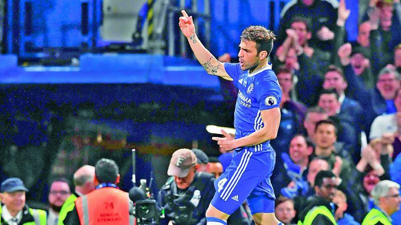 Chelseas Cesc Fabregas celebrates after scoring against Watford in their English Premier League match at Stamford Bridge in London on Monday. The hosts won 4-3. (Photo: AFP)