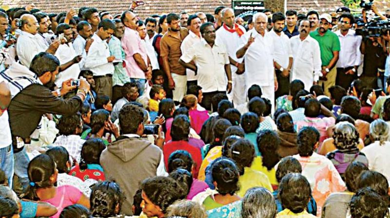 BJP president B.S. Yeddyurappa addressing a recent meeting of the protesting tribals in Diddalli in Kodagu