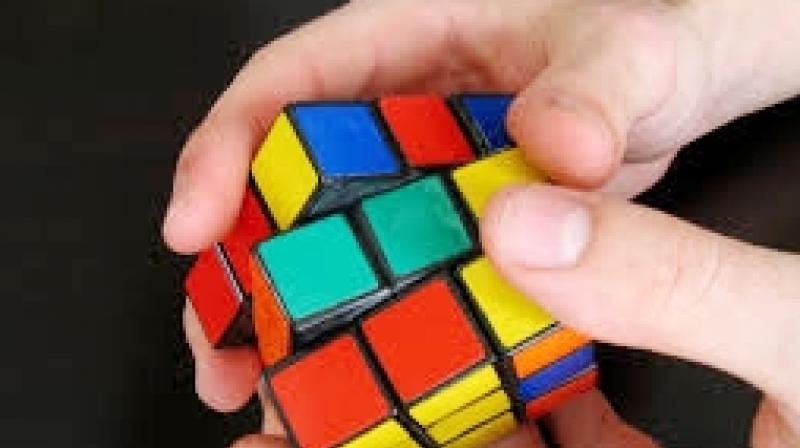 The Rubiks Cube consists of six faces, each having nine squares of a colour that can be turned in opposing directions.