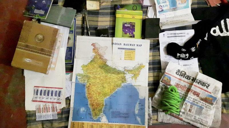 Arms, ammunition and other items, including a railway map, recovered after suspected terrorist Saifullah was killed in a 12-hour long operation by an ATS team on the outskirts of Lucknow. (Photo: PTI)